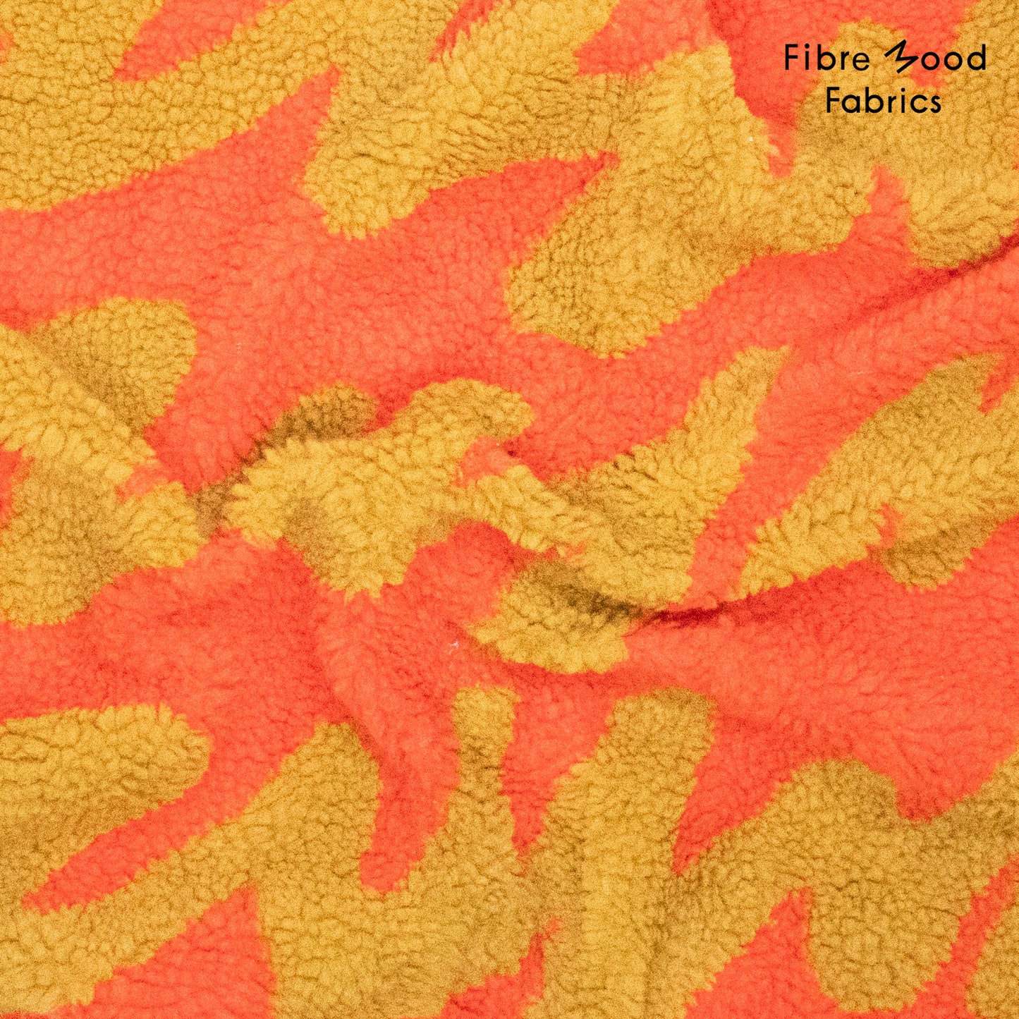 Tejido teddy jacquard tostado y naranja