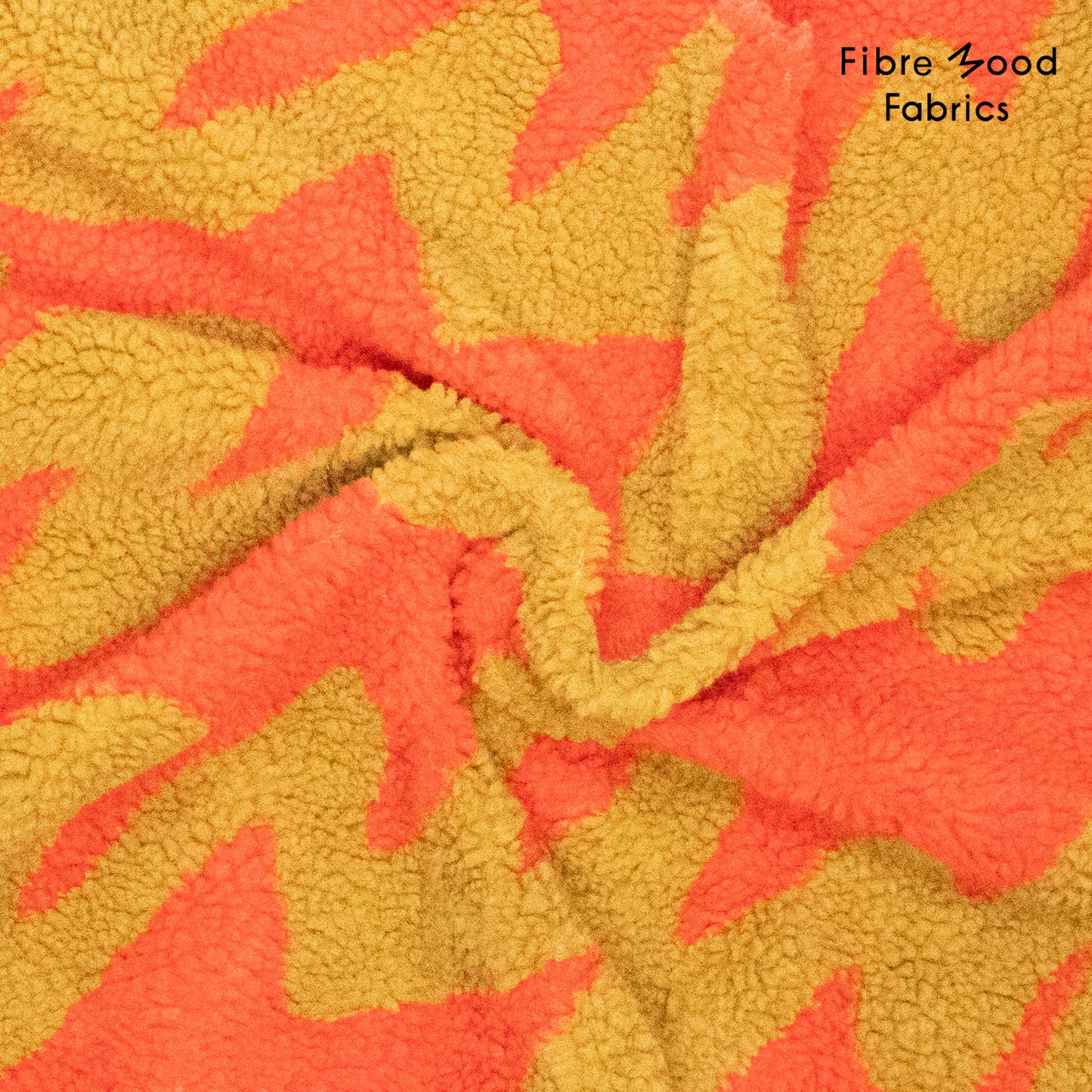 Tejido teddy jacquard tostado y naranja