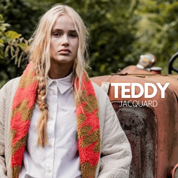 Tejido teddy jacquard tostado y naranja