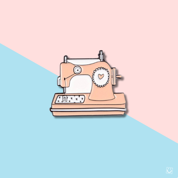 Broche máquina coser rosa